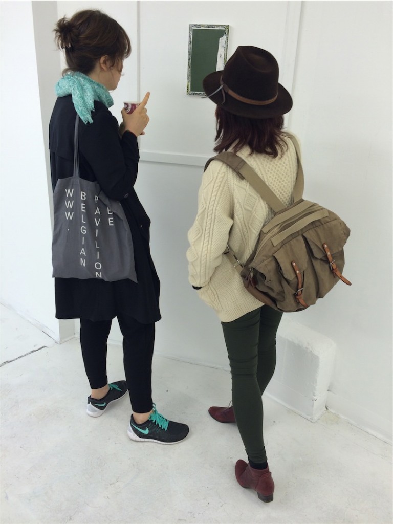 Sofia Silva and Anna Jung-Seo in discussion at the opening of "Fire Sale" at Dynamite Projects. Painting by Christopher Green.