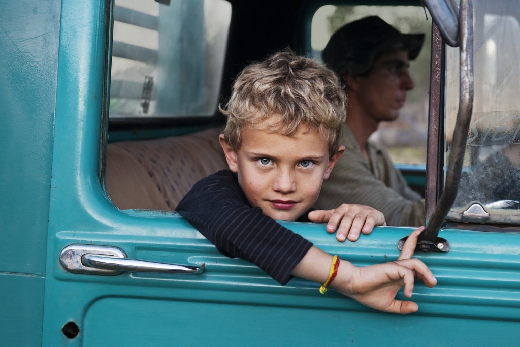 Steve McCurry, A farmer’s son on his father’s truck, Lambari, Brazil, 2010